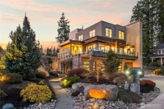A fortress of modern design by Hoppet Design & Construction. This 4,669 SF steel-clad residence sits in an exclusive gated enclave on Reid Drive, just moments from the downtown waterfront.