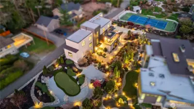 Privacy in the heart of town. Situated in a gated luxury enclave, the home offers a rare blend of industrial architectural significance and tranquil harbor living.