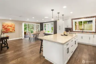 Exceptional sightlines connects all the day-to-day living areas including the dining area and living room off off the kitchen, and French doors to the back yard.