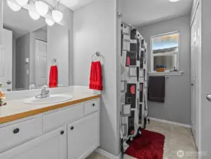 Down the hall is the bathroom.