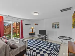 Finalizing the inside is the rec room with access to the backyard.