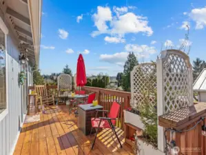 Look out at the mountain views from the amazing deck. You might even be able to see Mount Rainier.