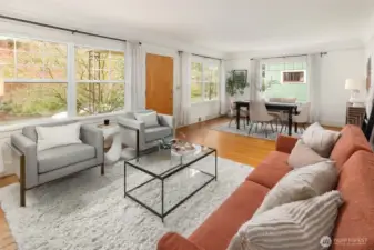 Open living dining area set up off the street and filled with natural light.