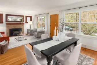 Open living dining area set up off the street and filled with natural light.