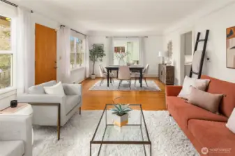 Open living dining area set up off the street and filled with natural light.