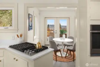 Enjoy cooking on your new gas cooktop looking out to the beautiful view of the Ship Canal and Olympic Mountains on a clear day.