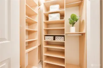 Awesome walk-in closet with custom shelving through-out!