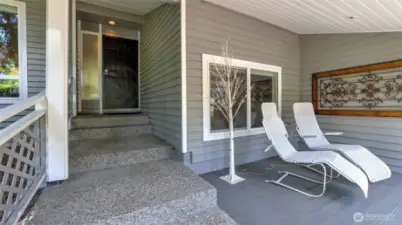Elegant walk-up entrance leads to an expansive covered patio—ideal for stylish outdoor living and year-round enjoyment, with room for outdoor seating, a cozy couch, or a full table setup