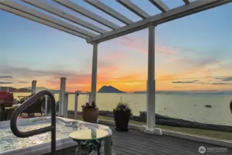 Soak in the hot tub while relaxing with the view