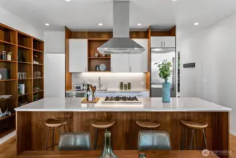 Crafted for cooks, designed for connection. A generous island, open shelving, and premium Bertazzoni appliances make this kitchen both functional and beautiful—centered in the home, and built for sharing.