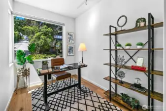 Work with a window to the world. Tucked into a quiet corner, the dedicated home office offers leafy outlooks and inspiring light—ideal for focus, creativity, or daydreaming between Zoom calls.