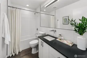 Crisp, clean, and guest-ready. The lower-level full bath features sleek finishes, ample storage, and a soaking tub—offering comfort and convenience for guests or everyday use.