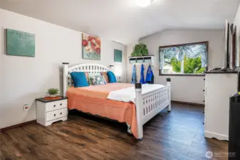 HUGE Primary suite with vaulted ceilings, it's own private bathroom, sitting area AND a large walk in closet!