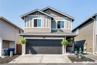 Large alley access to the 2 car attached garage and sweet covered walkway.