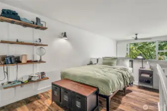 Large lofted sleeping area with new flooring.