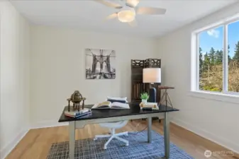 The first bedroom is adjacent to the bonus room, which can also function as an office.