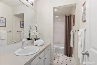 Main floor bath with bathtub/shower.