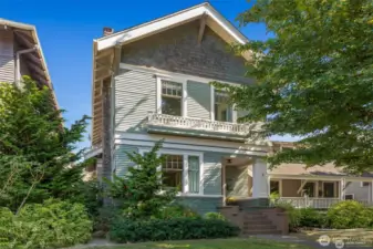 The classic lines and original exterior details  - cedar shingles, siding, multi paned  windows, sweet railing under the upstairs  windows, and front porch millwork have  been preserved and well maintained.
