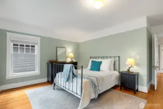 The Primary bedroom is large enough for a  Kind bed as well as a dresser and side tales.