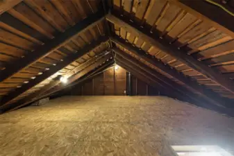 The attic is unfinished, but clean and dry  with floors installed over the insulation, and  offers lots of great storage!