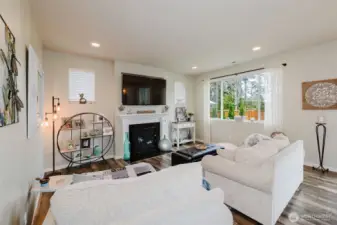 Family room with fireplace and tons of natural light