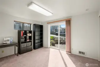 Downstairs bedroom with access to yard and gardening space