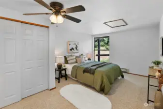 This spacious bedroom on the main floor is perfect to relax and stay cool in.