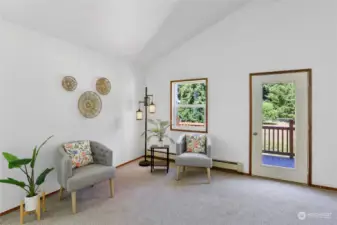 Gorgeous vaulted ceiling, and easy access to the deck - this room is just waiting for you to come relax for a bit.