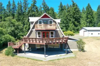 Looking toward this gorgeous home, you can also see the massive 1512 square foot shop/RV gararge/boat garage! Yes - a huge shop too!