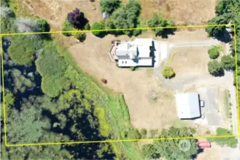 The aerial view here shows the approximate lot lines of the 2.39 acres.