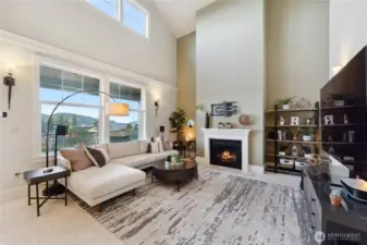 Cozing living come complete with a fireplace.