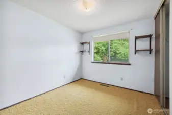 Second bedroom facing the backyard.
