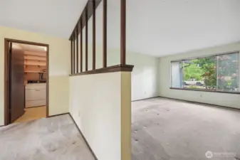 Divides the space & near the Utility Room.
