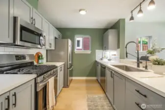 Stylish and functional kitchen with quartz counters, subway tile backsplash, and plenty of storage.