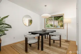 The dining room showing as seating for four is generously sized and can easily accomodate a larger table.