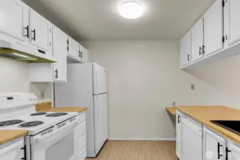 Freshly painted white kitchen cabinets.