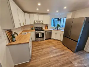 Kitchen with all new stainless steel appliances.