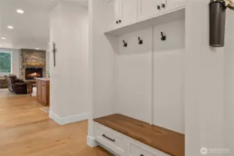 Custom entry bench with walnut top gives you a little preview of what is to come in the kitchen.