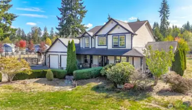 Custom built home on 10 acres with 3 car garage.