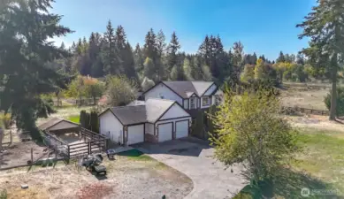 Dog run to the east of garage and turkey / chicken house / pen next to the dog run.