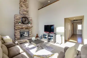 Beautiful propane gas fireplace is the focal point of the family room. 20' ceilings with floor to ceiling brick  stonework.