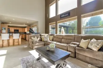 The family room has large picture windows offering tons of natural light and opens to the kitchen. Off the kitchen are French doors thaht leads to the expansive patio and has a partially covered area for year round grilling.
