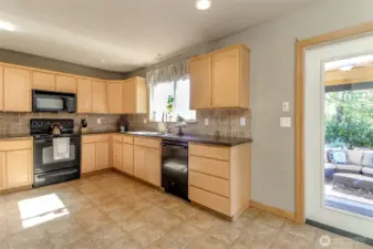 Open kitchen with lots of cabinetry and storage.