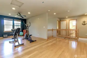 More open space to this loft / bonus room. The open door is the full bathroom.