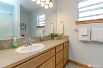This is the full bathroom upstairs. You can see in the mirror the tub/shower and the commode is next to the window recessed wall.