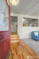 Welcome in!  To the right is the living room and up the stairs is the dining room.