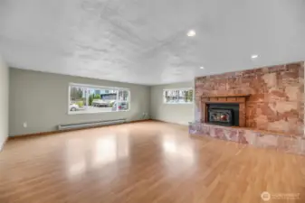Notice the windows in the large family room with beautiful wood fireplace