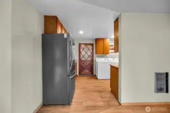 Door going out to the backyard from kitchen area