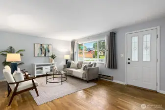 The living room is large with ample room for big furniture and even an L-shaped couch.