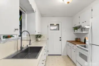 The sink is large and new! Plus the cabinets were sanded and painted.